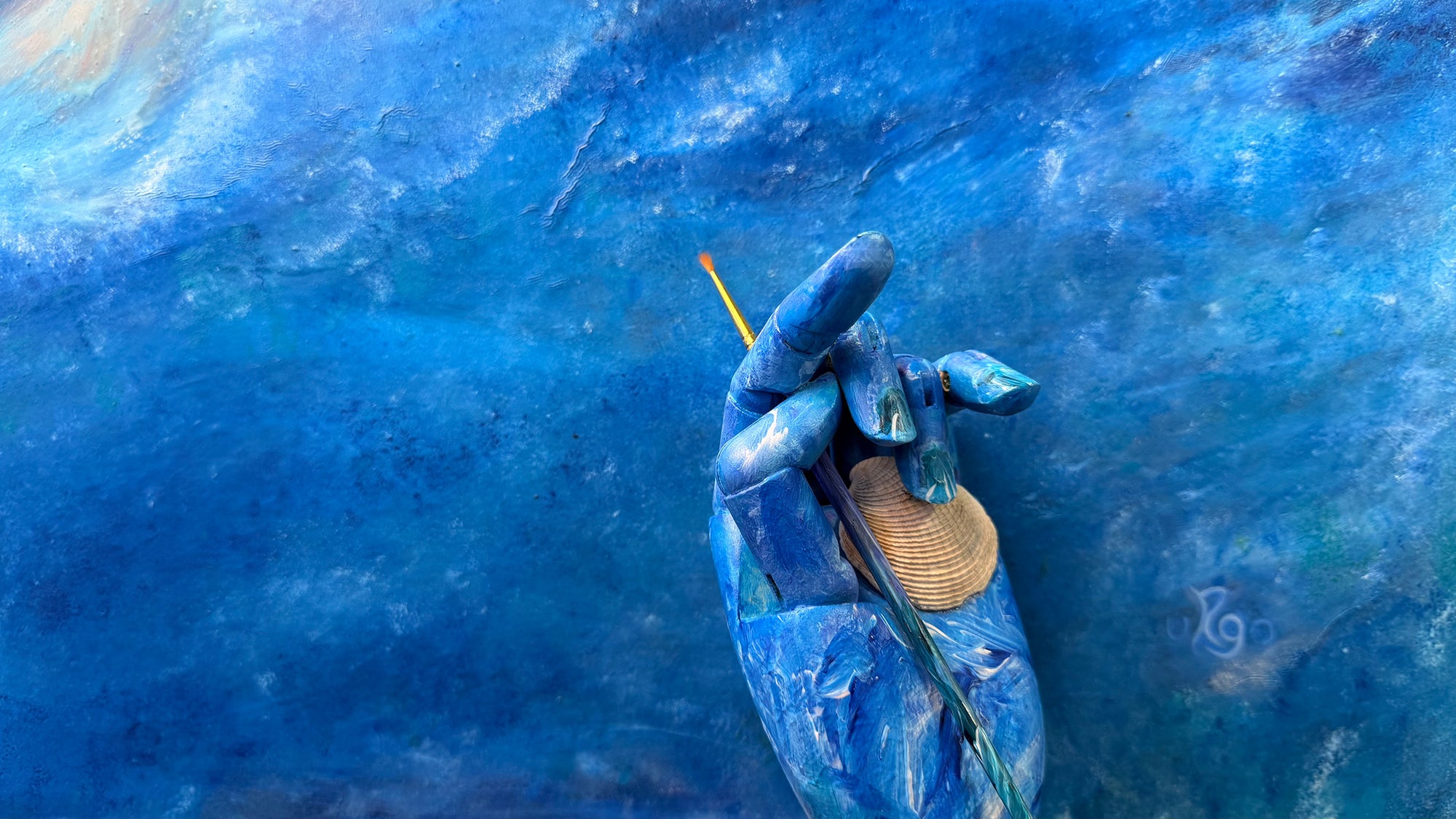 hand painted by robert gerson wood artist hand model on ocean painting background